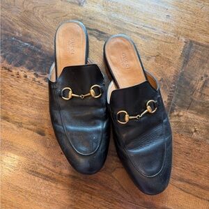 Gucci Black Leather Mules with Gold Accents